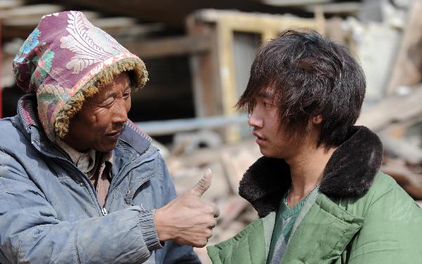 Quake hero - young man digs out seven with bare hands