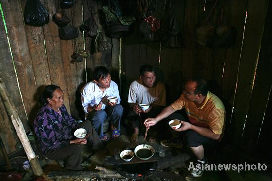 Villagers rebuild sole road after flood