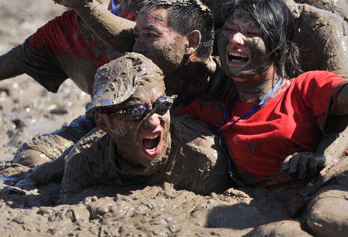 Competitors get all muddy