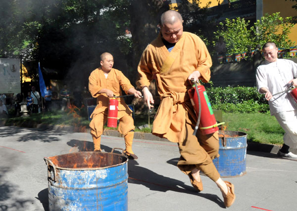 Monks test their firefighting skills