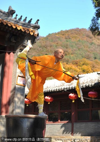 Buddhist nun shows off her strength pulling cars