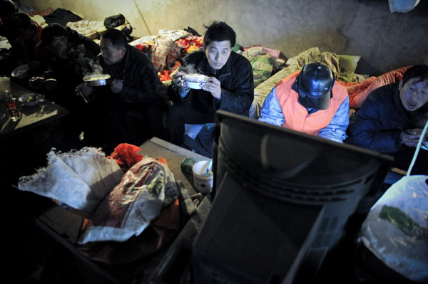 Migrant workers make their home under overpass