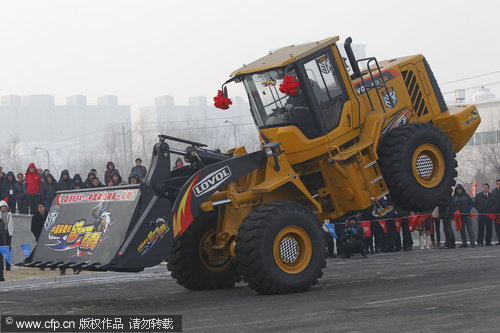 Loader performs break-dance stunts