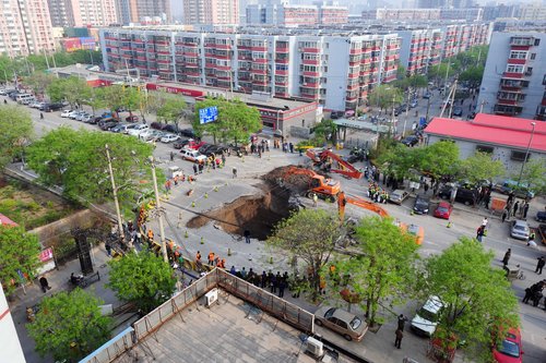 Road caves in, swallowing truck