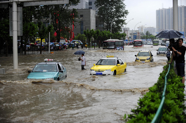 Wuhan wades through heavy rainstorm