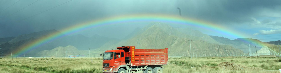 Rainbow appears over desert