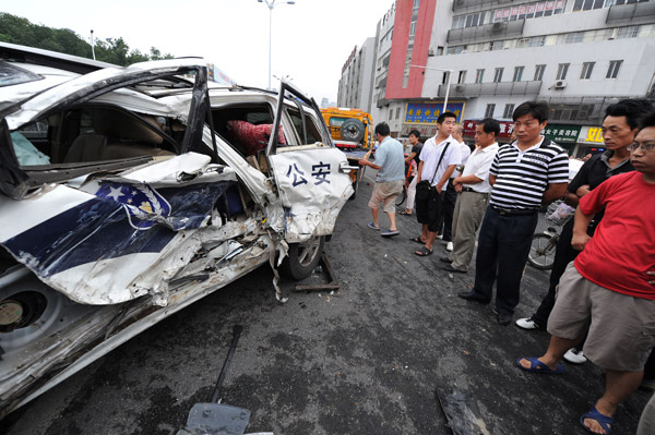 Car crushed, people injured