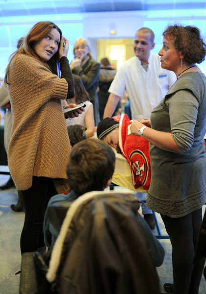 French First Lady Bruni visits disabled children