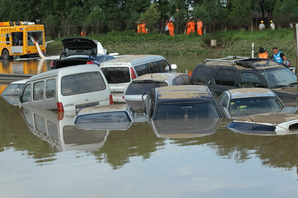 Deadly storm leaves 15,000 cars damaged