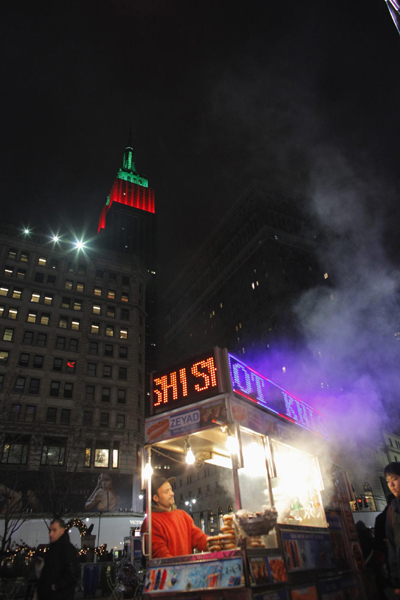 Empire State Building lit up in red and green