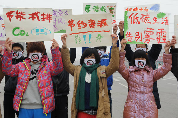 Masked students call for clean environment