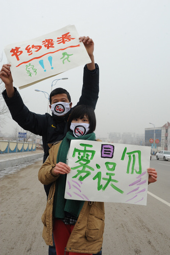 Masked students call for clean environment