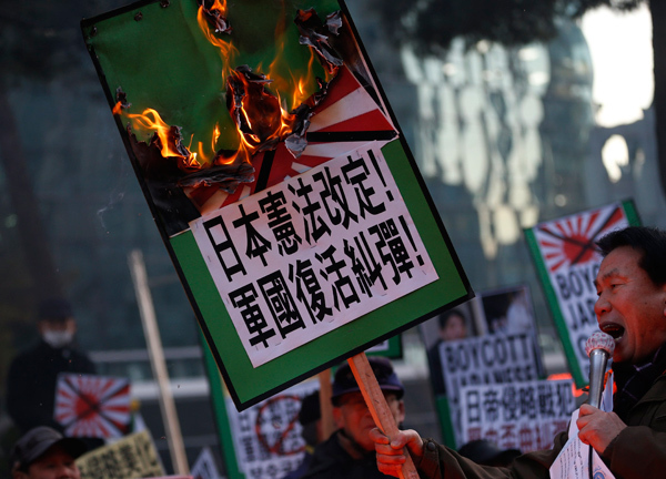 Abe's war shrine visit sparks protest