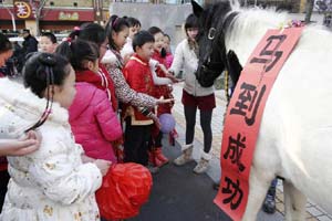 Horses run on snow-covered Tianshan in Xinjiang