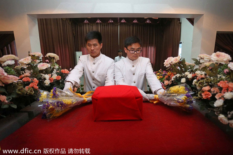 Young funeral directors in modern ceremony