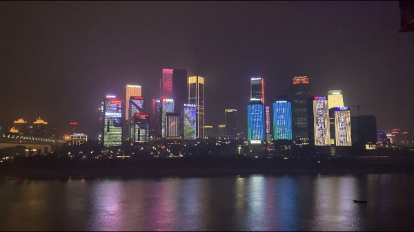 TV trailer plays across Chongqing skyscrapers