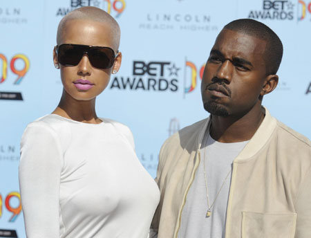 Rapper Kanye West poses with Amber Rose while at the BET Awards '09