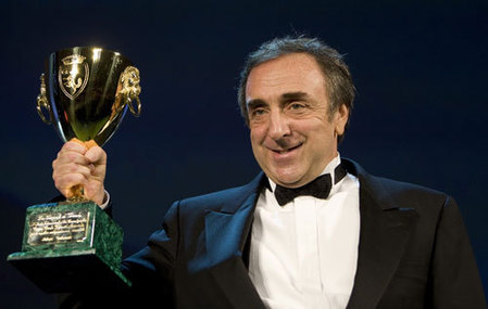 Orlando holds Coppa Volpi trophy for Best Actor at Venice