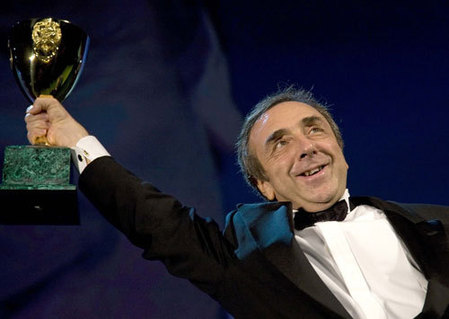 Orlando holds Coppa Volpi trophy for Best Actor at Venice