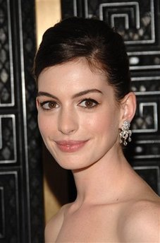 Paparazzo crashes bike into Anne Hathaway's car