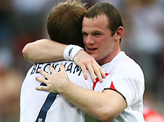 England's David Beckham (L) and Wayne Rooney celebrate after team mate Peter Crouch's goal against Trinidad and Tobago during their Group B World Cup 2006 soccer match in Nuremberg June 15, 2006. 