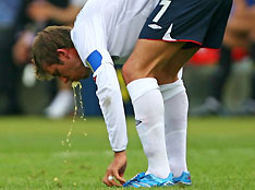 England's David Beckham vomits on the pitch during their second round World Cup 2006 soccer match against Ecuador in Stuttgart June 25, 2006. 