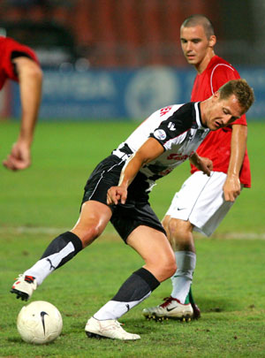 Schumacher plays soccer during a charity game