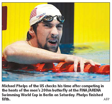 Phelps flops as world records tumble