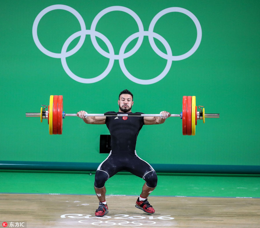 Chinese weightlifter Shi ZhiYong lifts gold