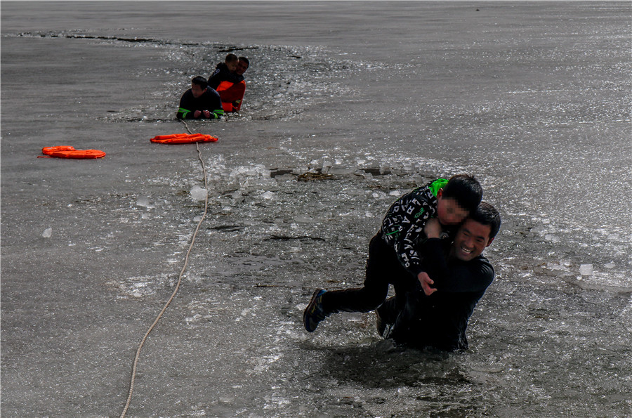 Firefighters rescue boys who fell through thin ice in NW China