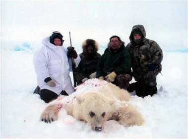 In this undated photo provided by the Canadian Wildlife Service, hunter Jim Martell, left, is seen with a hybrid bear he shot while on a hunting expedition on Banks Island, Northwest Territory, Canada. According to Dr. Ian Stirling, researcher for the CWS, genetic tests showed the bear had a polar bear for a mother and a grizzly bear for a father. Roger Kuptana, center, right, was the guide on the expedition. The other men are unidentified. (A