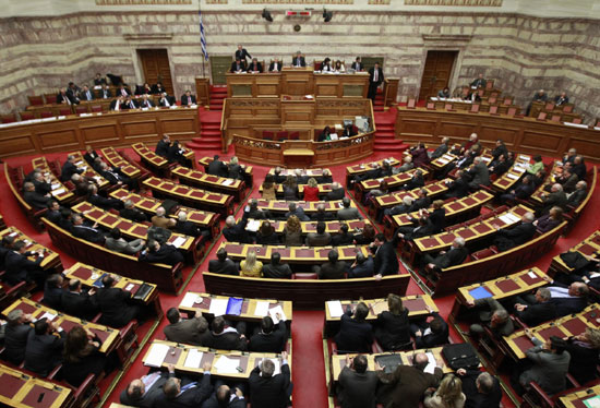 Greece adopts austerity plan as pressure mounts