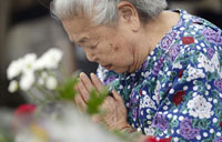 Hiroshima residents protest against Abe over collective defense