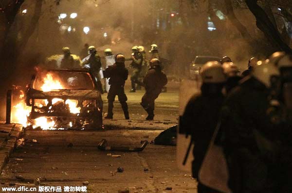 Greek anti-establishment protesters torch cars, clash with police