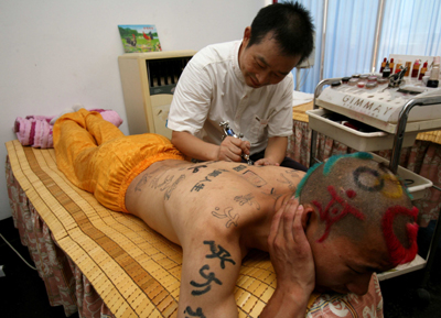 Man got tattoos to hail the Olympics