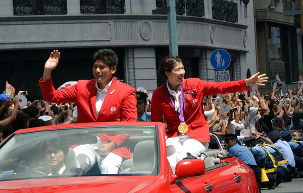 First Olympic parade brings Tokyo to standstill