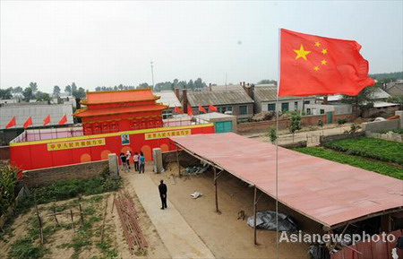 Tiananmen replica made up of broomcorn stalks