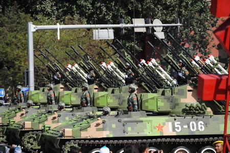 Weapons and equipment are displayed in parade