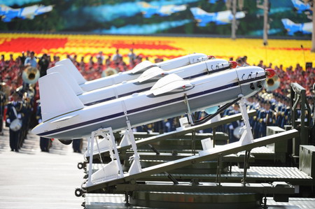 Weapons and equipment are displayed in parade