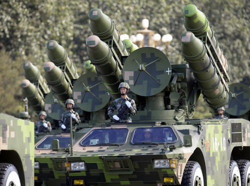 Weapons and equipment are displayed in parade