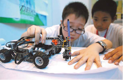 Student scores with her robot footballer