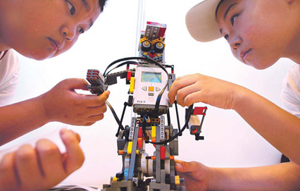 Student scores with her robot footballer