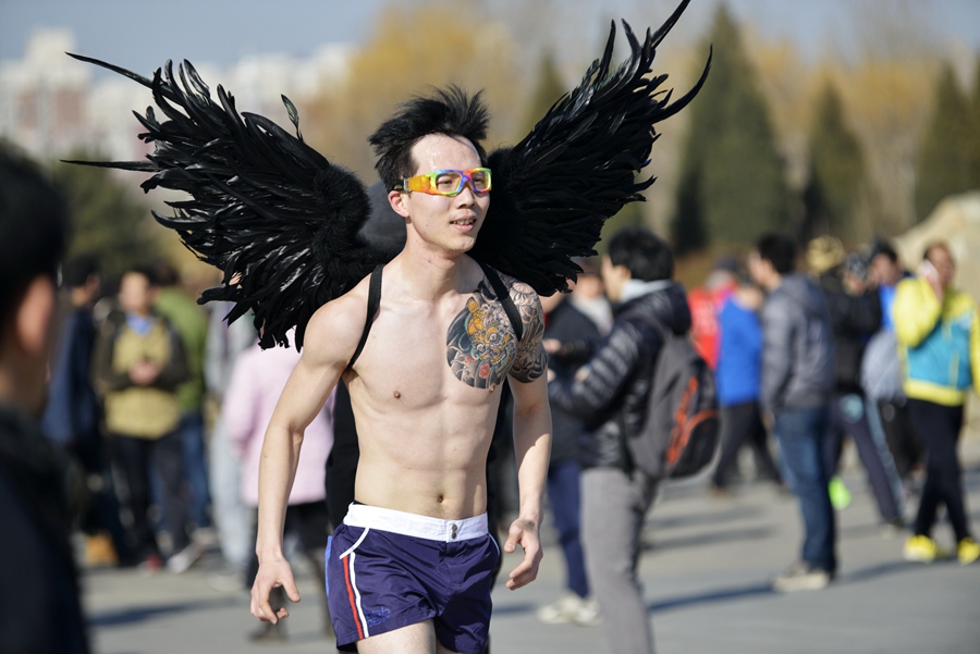 Monkey king, angel and superwoman at Beijing's Undie Run race