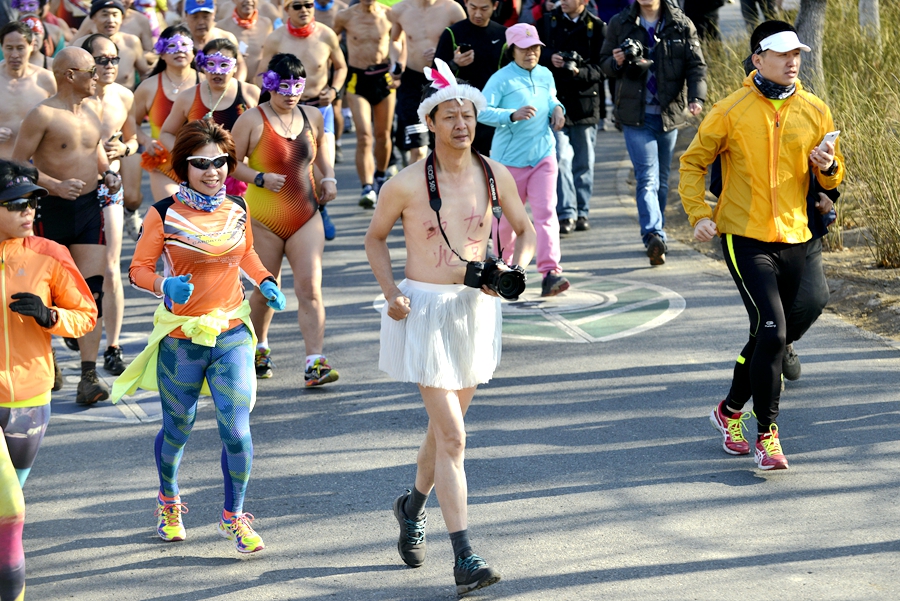 Monkey king, angel and superwoman at Beijing's Undie Run race