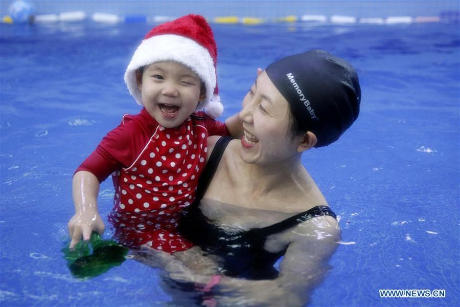 Babies in Beijing's Christmas swimming party