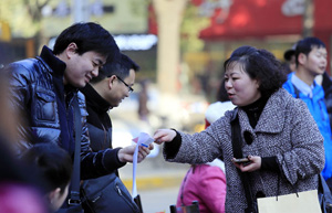 Chinese migrant workers' wages up 13.9%