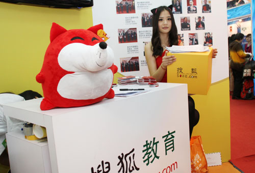Sohu.com income declines by nearly half