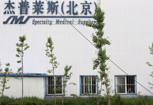 US factory boss held hostage in Beijing
