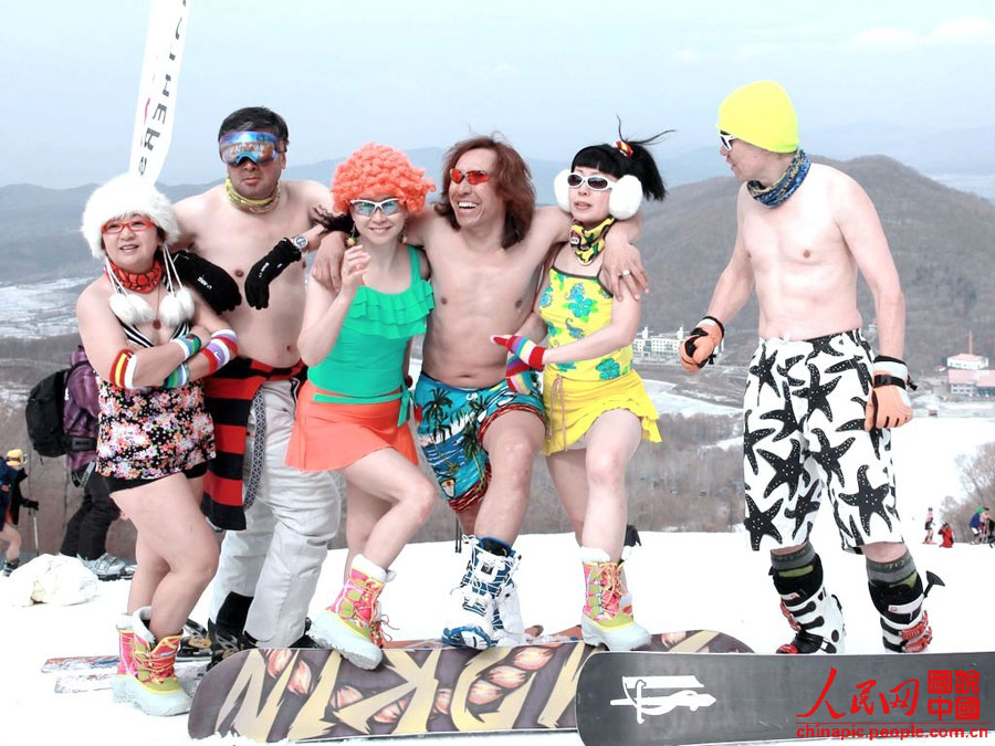 Skiers in swimsuit bid farewell to ski season