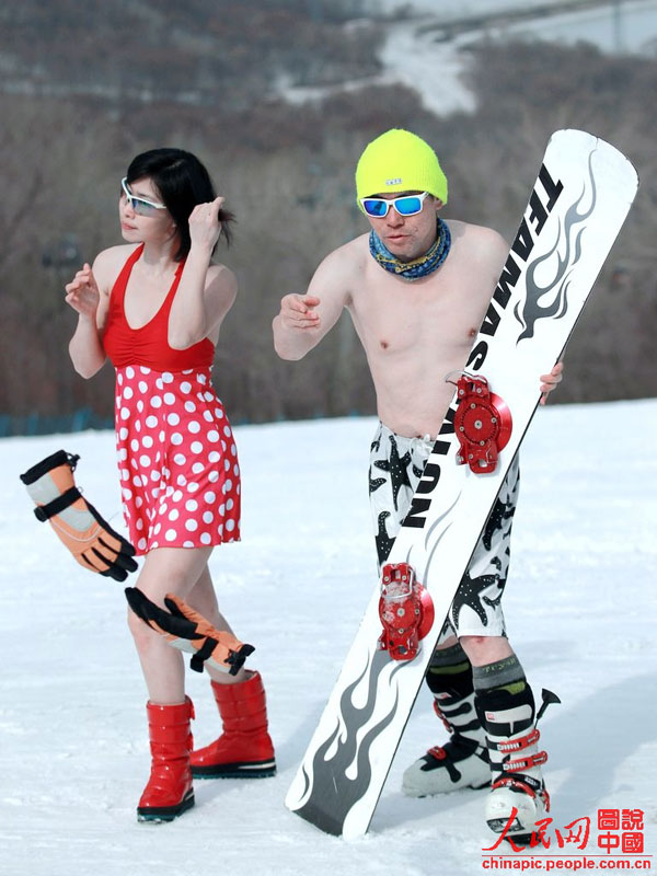 Skiers in swimsuit bid farewell to ski season